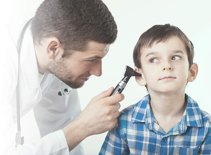 Doctor looking into ear