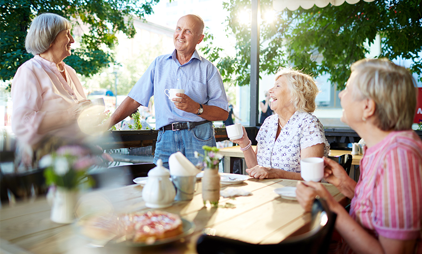 Group of older adults drinking coffee together