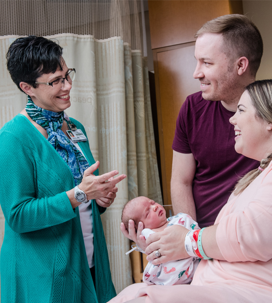 Maple Grove Hospital team member with couple and new baby