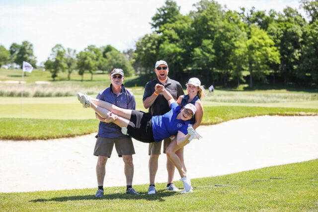 Golfers posing at event