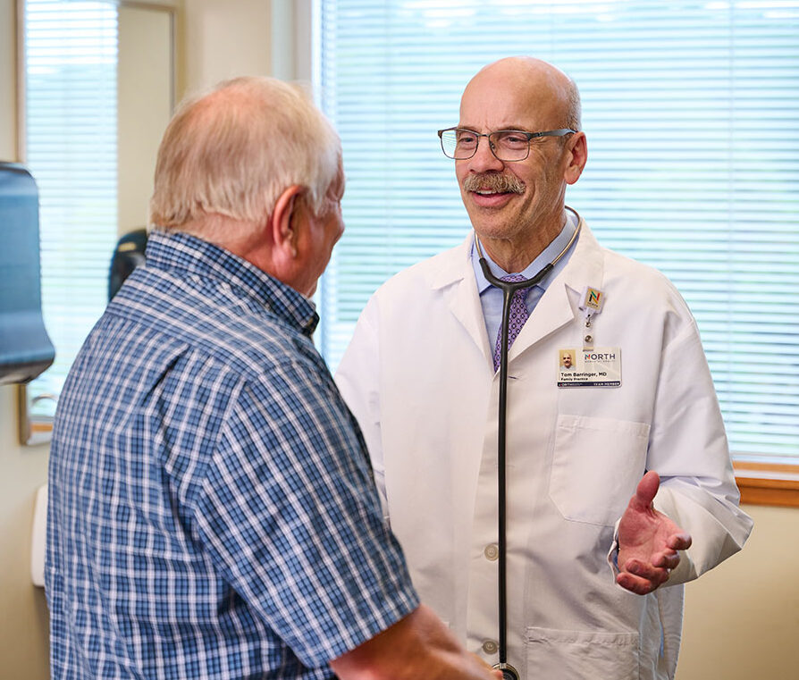 Dr. Thomas Barringer with patient