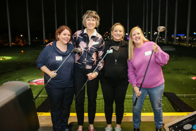 Group photo from the Topgolf Gobbler event