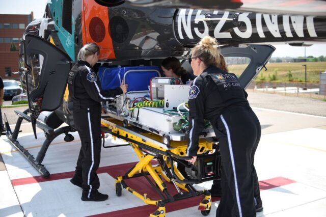 North Memorial Health team members with helicopter