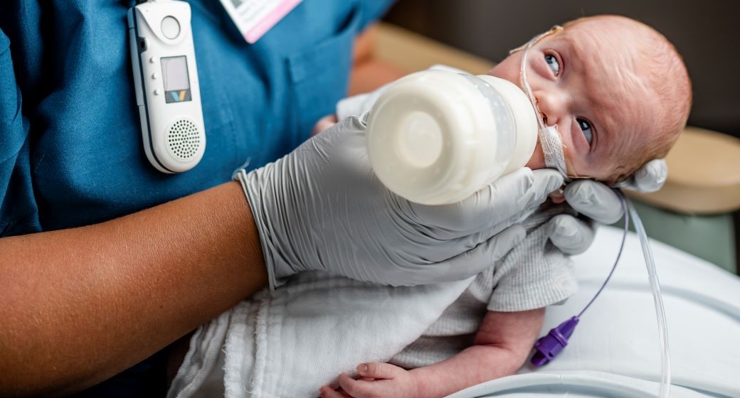 NICU Baby being fed a bottle