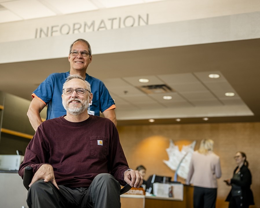 Maple Grove Hospital Information Desk with patient and nurse