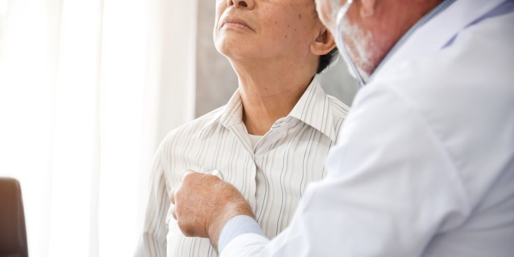 Doctor examines male patient